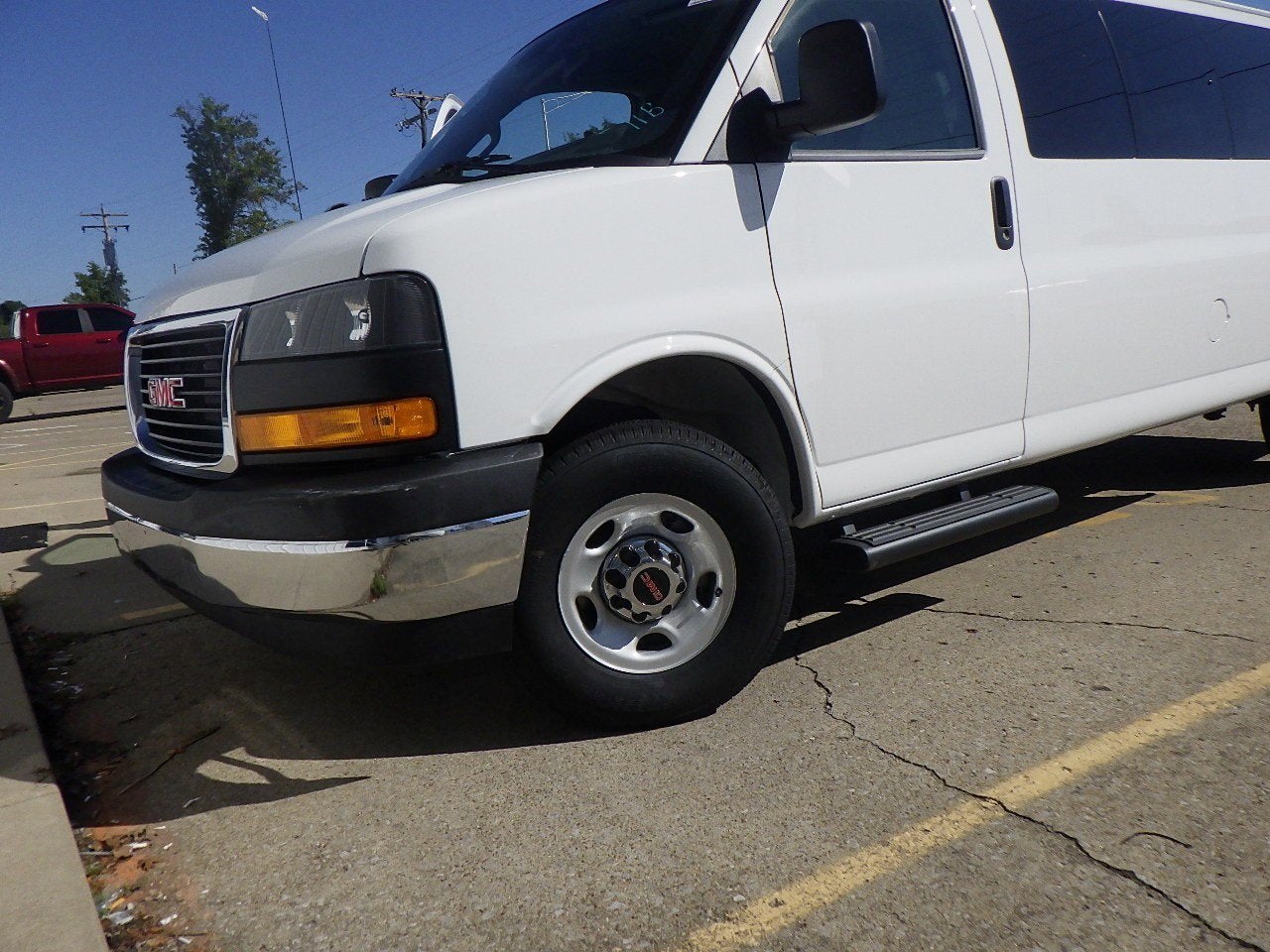 2025 GMC Savana Passenger LT in Summit White — front three-quarter view