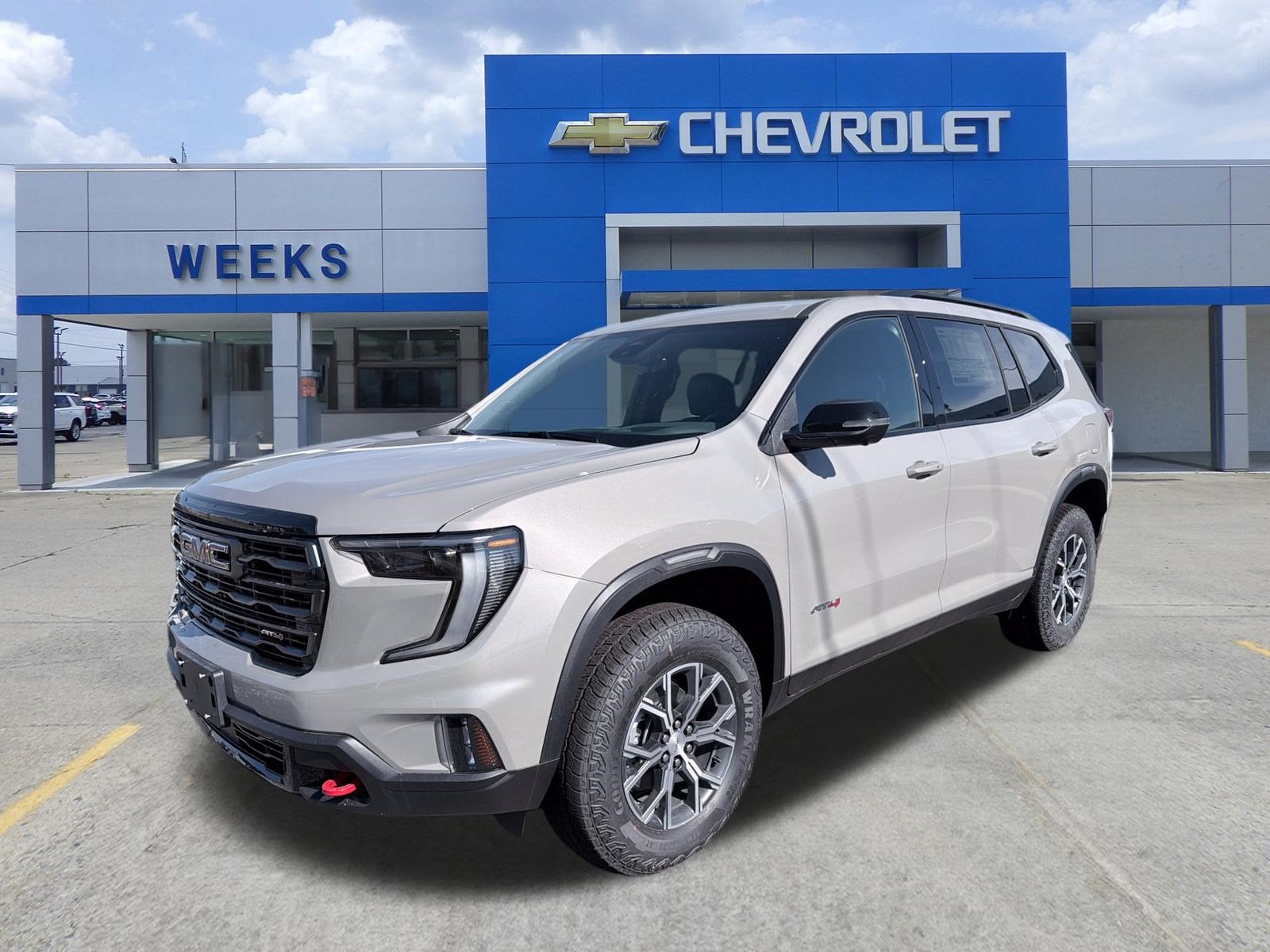 2026 GMC Acadia AT4 in Riverstone Metallic — front three-quarter view