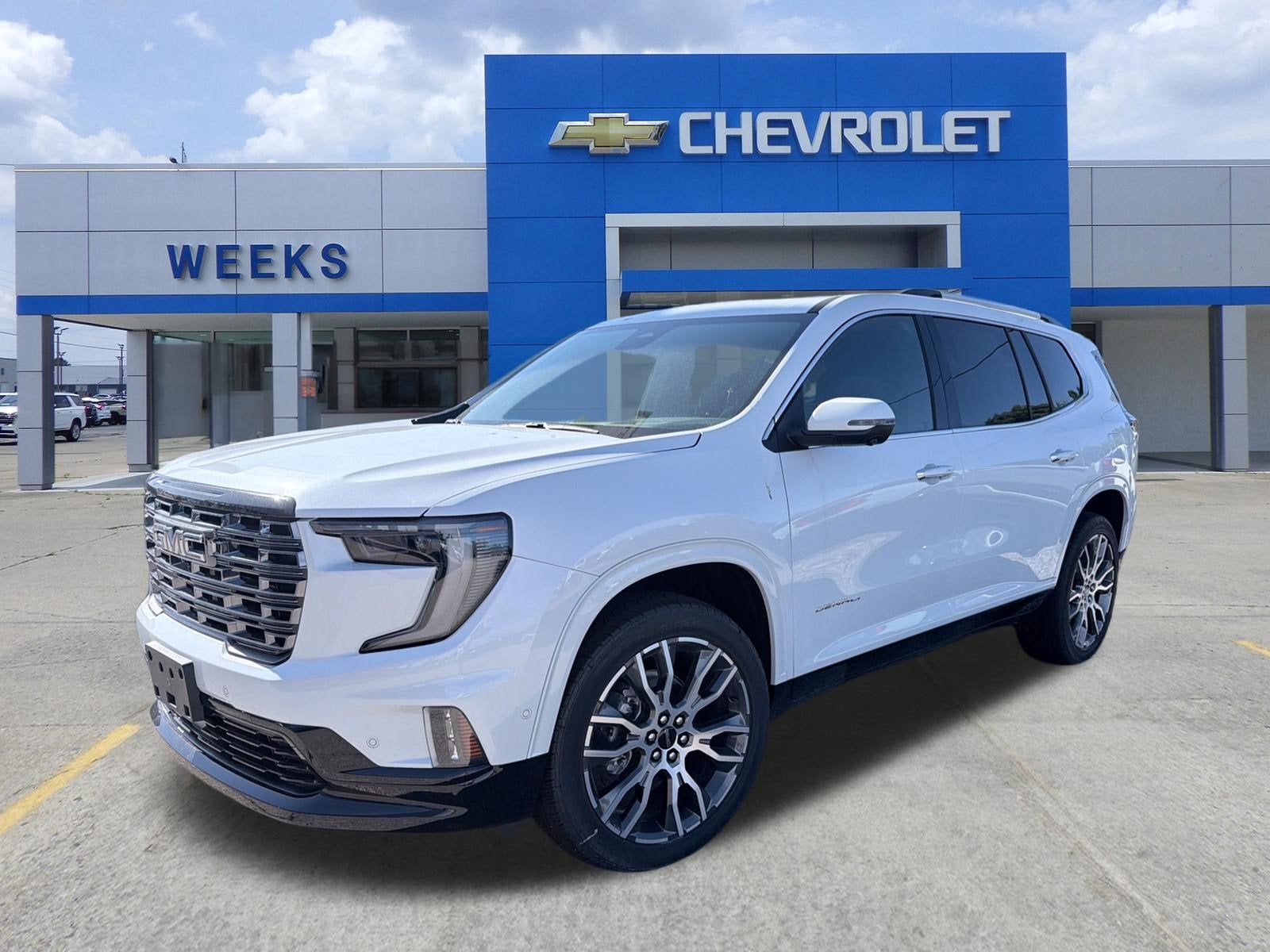 2026 GMC Acadia Denali Ultimate in Glacier White Tricoat — front three-quarter view