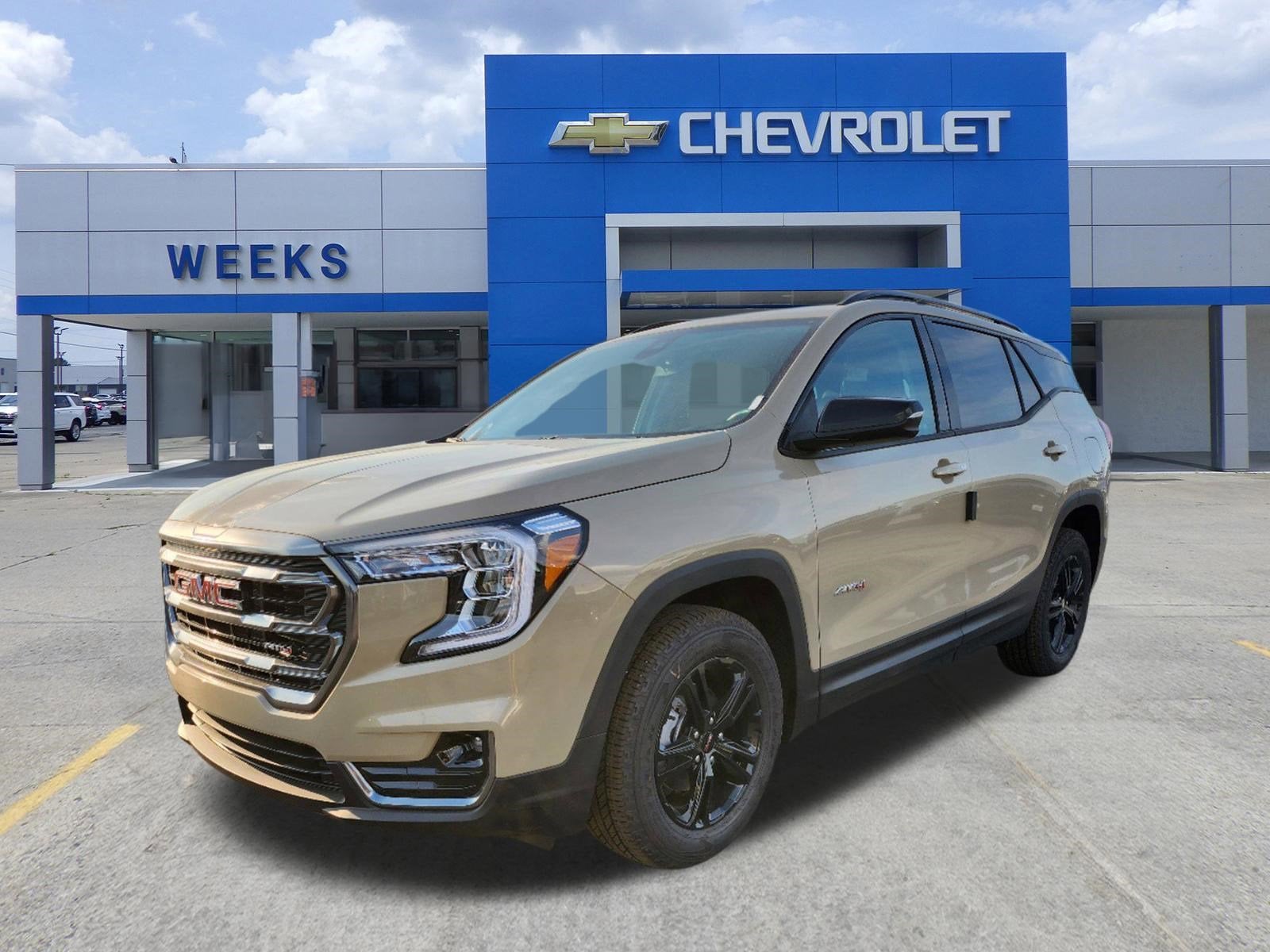 2022 GMC Terrain AT4 in Desert Sand Metallic — front three-quarter view