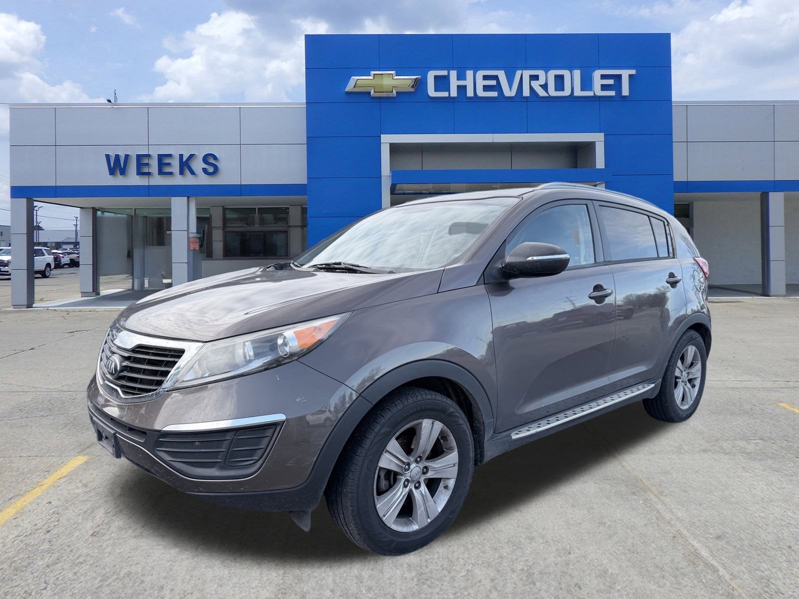 2013 Kia Sportage LX in Brown — front three-quarter view